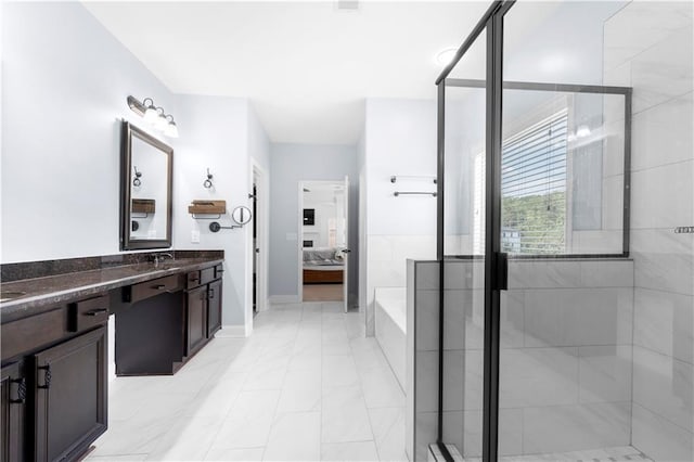 bathroom with vanity and separate shower and tub