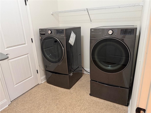 laundry area with washer and clothes dryer