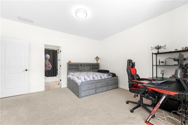 bedroom featuring light colored carpet