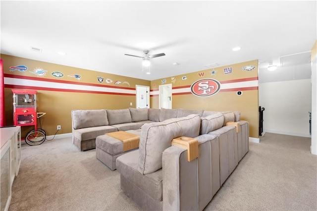 home theater room with light carpet and ceiling fan