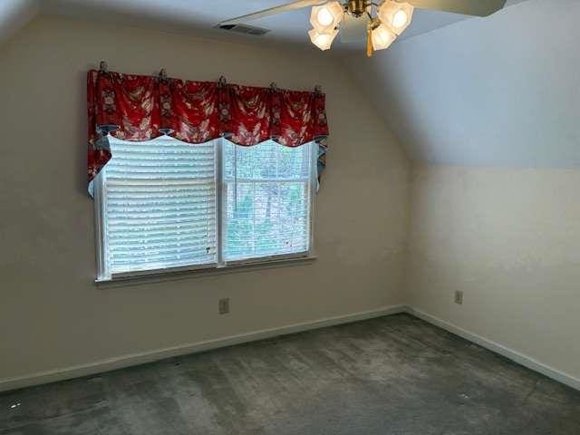 bonus room featuring visible vents, baseboards, ceiling fan, and vaulted ceiling