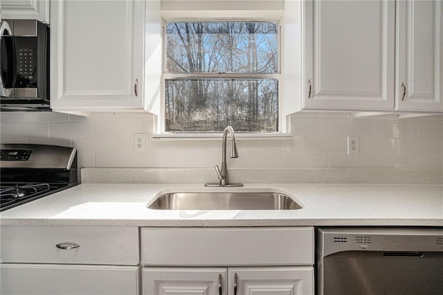 kitchen with white cabinets, sink, and stainless steel appliances