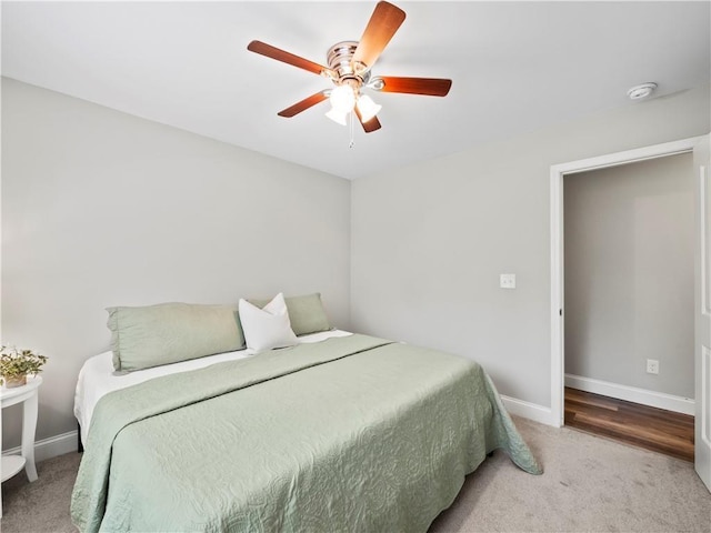 bedroom with ceiling fan and carpet