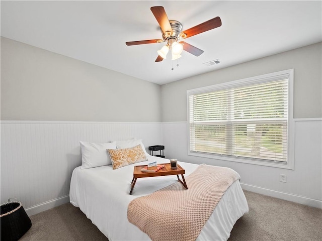 bedroom featuring ceiling fan and carpet floors