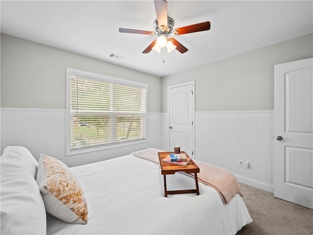 bedroom with ceiling fan and carpet