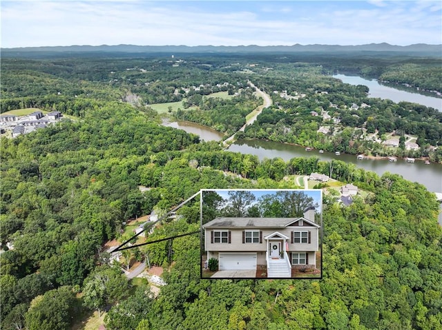 drone / aerial view with a water view