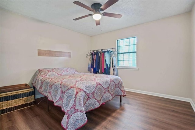 bedroom featuring dark wood-type flooring and ceiling fan