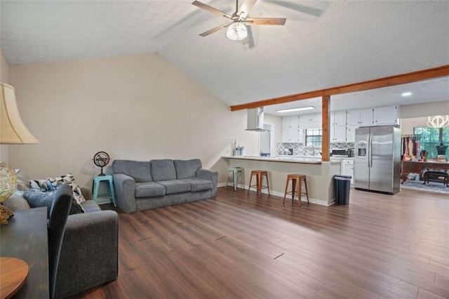 living room with lofted ceiling, dark wood-type flooring, and ceiling fan