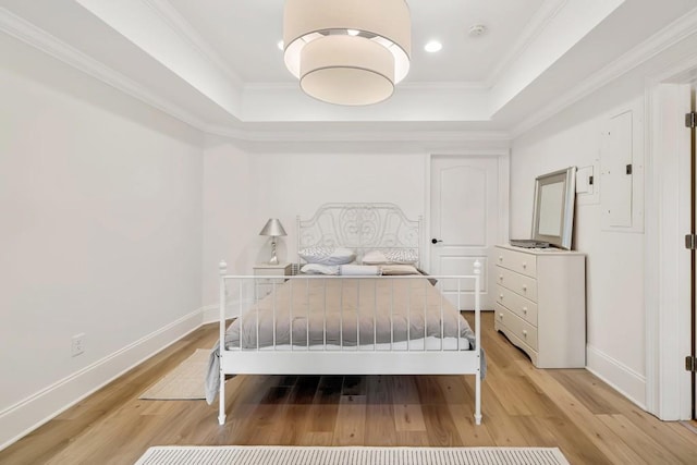 3925 Sheldon Dr NE, Atlanta, GA 30342 - bedroom featuring a raised ceiling, light wood-style floors, baseboards, crown molding, and recessed lighting