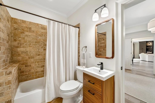 3925 Sheldon Dr NE, Atlanta, GA 30342 - full bath with ornamental molding, vanity, shower / bath combo with shower curtain, toilet, and wood finished floors