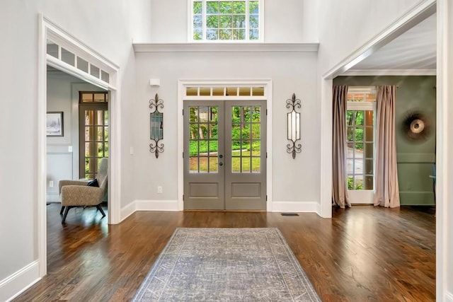3925 Sheldon Dr NE, Atlanta, GA 30342 - foyer entrance featuring french doors, wood finished floors, a high ceiling, and baseboards