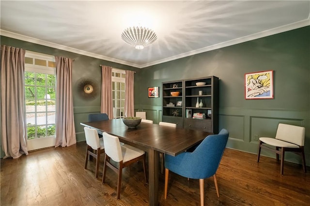 3925 Sheldon Dr NE, Atlanta, GA 30342 - dining area with ornamental molding, a decorative wall, dark wood-style floors, wainscoting, and a chandelier