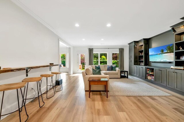 3925 Sheldon Dr NE, Atlanta, GA 30342 - living area featuring ornamental molding, healthy amount of natural light, light wood-style flooring, and recessed lighting