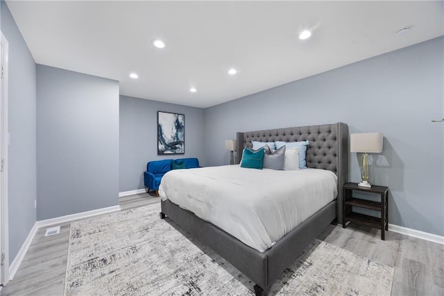 bedroom with light hardwood / wood-style floors