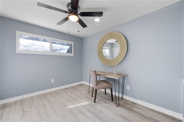 office space with light hardwood / wood-style flooring and ceiling fan