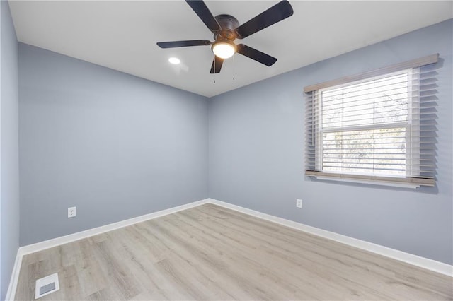 spare room with ceiling fan and light hardwood / wood-style floors