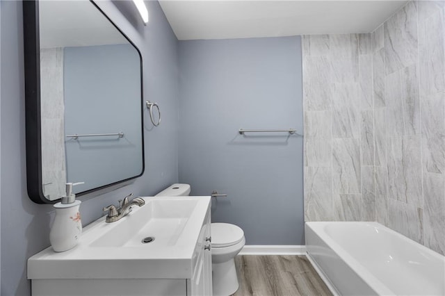 full bathroom featuring vanity, hardwood / wood-style flooring, bathing tub / shower combination, and toilet