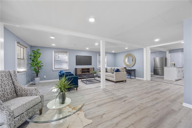 living room with light hardwood / wood-style flooring