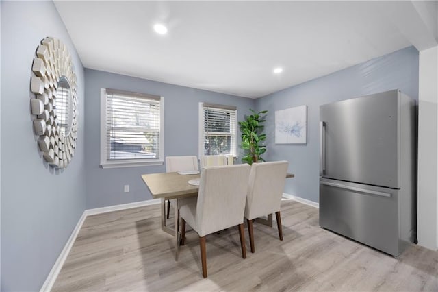 dining room with light wood-type flooring