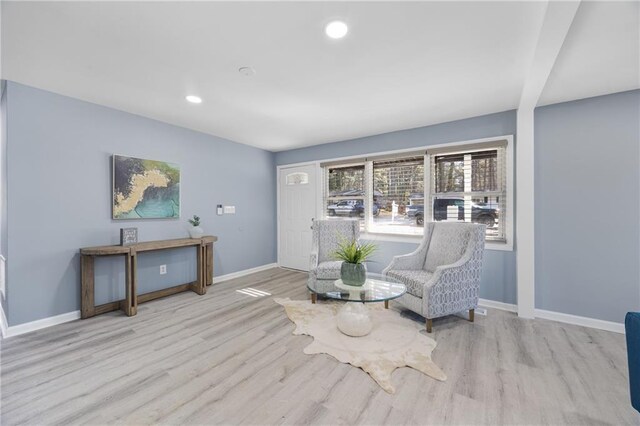 living area with light hardwood / wood-style flooring