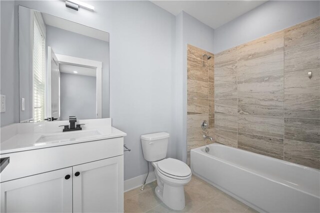 1048 Claudette Colvin Ct, Atlanta, GA 30318 - bathroom featuring baseboards, toilet, bathtub / shower combination, vanity, and tile patterned floors