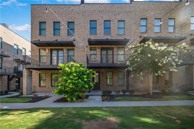1048 Claudette Colvin Ct, Atlanta, GA 30318 - view of front of property with brick siding and a front yard