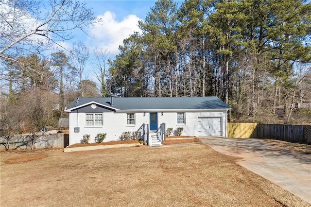 view of front of house with a garage and a front lawn