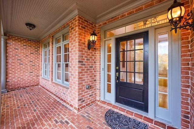 entrance to property featuring covered porch