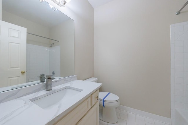 full bathroom with tile patterned floors, vanity, toilet, and tiled shower / bath combo