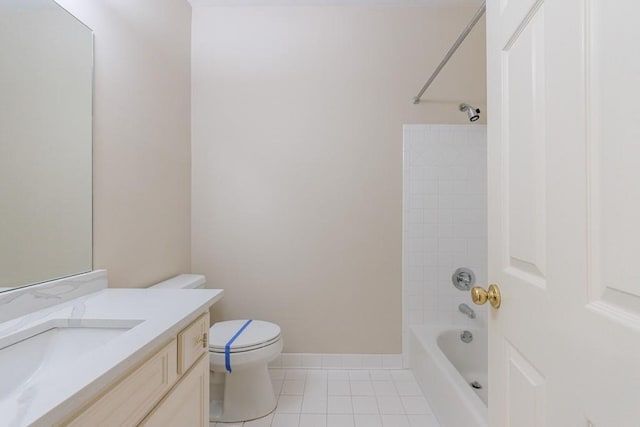 full bathroom featuring tile patterned floors, vanity, tiled shower / bath combo, and toilet