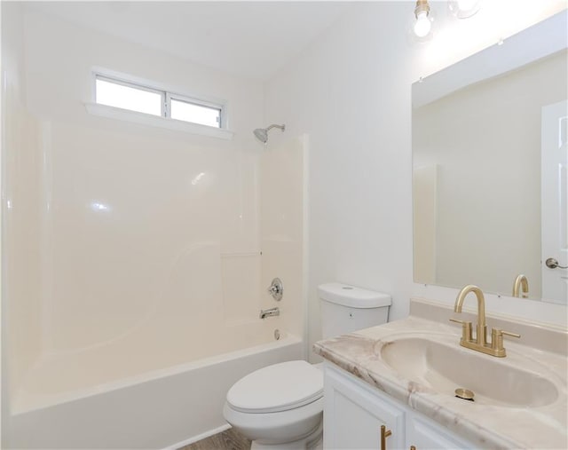 full bathroom featuring vanity, tub / shower combination, and toilet