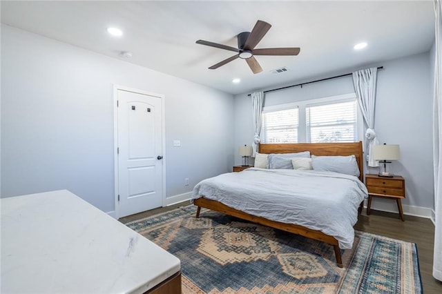 bedroom with visible vents, baseboards, ceiling fan, dark wood-style flooring, and recessed lighting