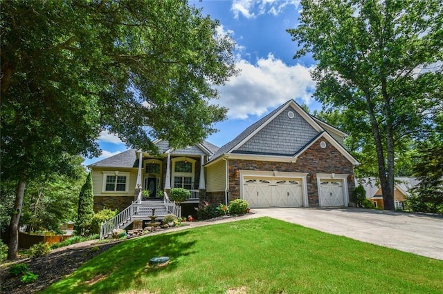 4742 Thunder River Dr, Gainesville, GA 30506 - craftsman house featuring stone siding, concrete driveway, an attached garage, and a front yard