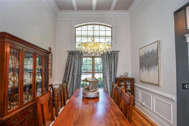 4742 Thunder River Dr, Gainesville, GA 30506 - dining space with a chandelier, a high ceiling, crown molding, a wainscoted wall, and coffered ceiling