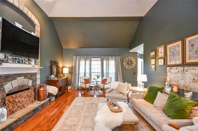 4742 Thunder River Dr, Gainesville, GA 30506 - living area featuring high vaulted ceiling, wood finished floors, and a fireplace