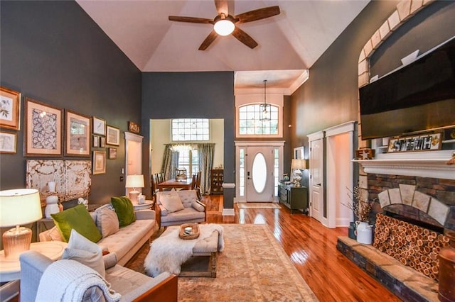 4742 Thunder River Dr, Gainesville, GA 30506 - living room featuring high vaulted ceiling, wood finished floors, ceiling fan, and a fireplace