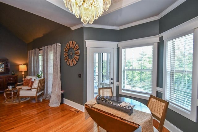 4742 Thunder River Dr, Gainesville, GA 30506 - dining room with a chandelier, light wood-style floors, healthy amount of natural light, and crown molding