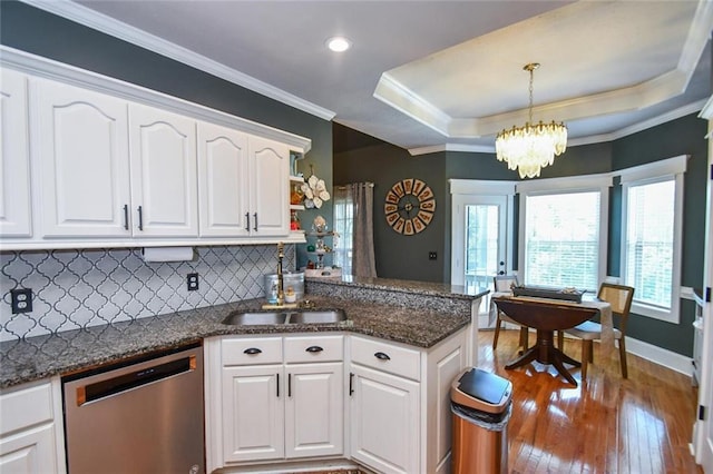 4742 Thunder River Dr, Gainesville, GA 30506 - kitchen with dishwasher, a peninsula, white cabinets, decorative backsplash, and a chandelier