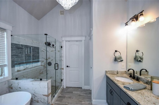 4742 Thunder River Dr, Gainesville, GA 30506 - full bathroom featuring a freestanding tub, vanity, wood finished floors, a stall shower, and lofted ceiling