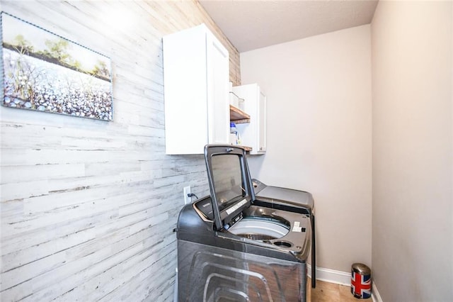 4742 Thunder River Dr, Gainesville, GA 30506 - laundry area with cabinet space and wood walls