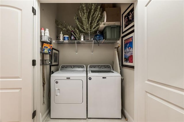 clothes washing area featuring washing machine and clothes dryer