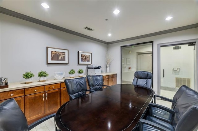 home office featuring light tile patterned floors and crown molding