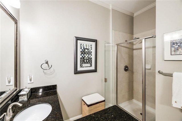 bathroom featuring crown molding, vanity, and an enclosed shower