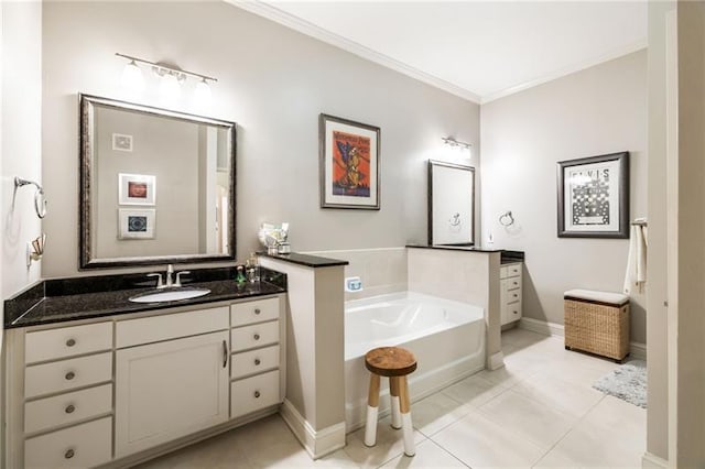 bathroom with tile patterned floors, vanity, ornamental molding, and a tub