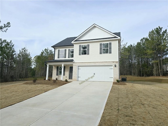 view of front of house with a garage and a front lawn