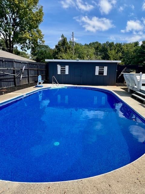 view of swimming pool featuring a fenced in pool and a fenced backyard