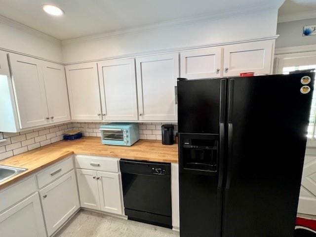 kitchen with decorative backsplash, black appliances, white cabinets, and wooden counters