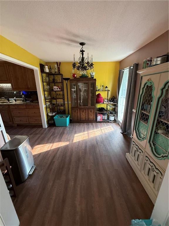 222 Akin Rd, Martin, GA 30557 - living room featuring dark wood finished floors, a chandelier, and a textured ceiling