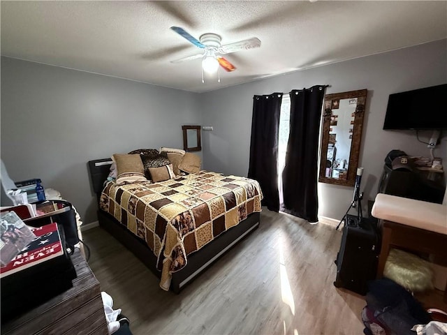 222 Akin Rd, Martin, GA 30557 - bedroom featuring light wood finished floors, baseboards, ceiling fan, and a textured ceiling