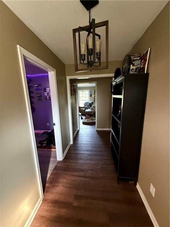 222 Akin Rd, Martin, GA 30557 - corridor with dark wood-type flooring, a chandelier, and baseboards